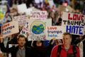 Anti-Trump protesters in Madison, Wisconsin. The president-elect's Twitter account has excoriated and then saluted them.