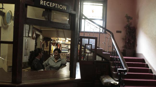 Rose Banks and Yvette Kelly behind the desk at the Gatwick Hotel, which attracts the disadvantaged.