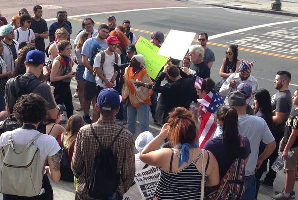 Protesters gather on the steps of City Hall in downtown Los Angeles. (Deborah Netburn / Los Angeles Times)