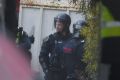 Police in riot gear outside the Parkville Youth Justice Centre on Monday.