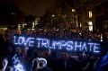 Illuminating message: Demonstrators hold a neon sign reading "Love Trumps Hate" during a protest at Union Square in New York.