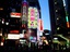 The street light up with commercial establishments and ads in Shibuya district in Tokyo, Japan