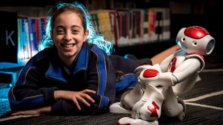 Grade 4 student Romy Szmulewicz with robot Rosie at the Biallik College. 