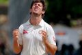 Caught in the middle: Mitchell Marsh.