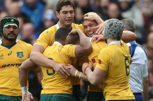 Reece Hodge celebrates after he scores Australia's first try of the game.