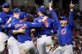 Cubs celebrate after a marathon rain-affected decider against Cleveland.