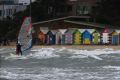 Windy weather in Melbourne brings out the kite boarders and wind surfers at Brighton Beach.