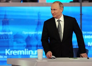 Russian President Vladimir Putin arrives at his annual call-in show in Moscow, Russia, Thursday, April 14, 2016.