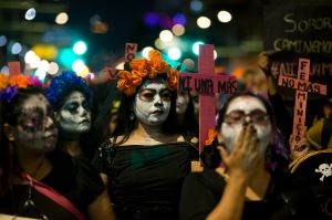 Women dressed as traditional Mexican "Catrinas" march during a demonstration to protest violence against women in Mexico ...