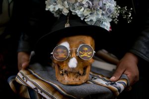 A human skull or "natitas" wearing sun glasses, is displayed outside the Cementerio General chapel during the Natitas ...