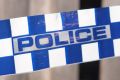 Blue and white Police tape cordoning off broken fence area at a residential house like a crime scene, Australia 2016