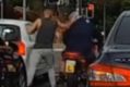 Dashcam footage recorded a Lyneham intersection shows a road rage incident in which a motorcyclist assaulted.