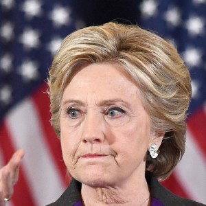 US Democratic presidential candidate Hillary Clinton makes a concession speech after being defeated by Republican President-elect Donald Trump, as former President Bill Clinton looks on in New York on November 9, 2016. (Jewel Samad/AFP/Getty Images)