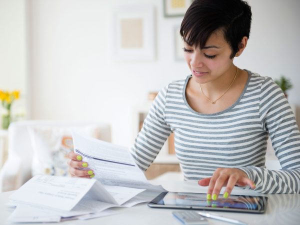 Young woman creating personal budget.