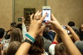 She's back there somewhere: crowds viewing the Mona Lisa at the Louvre.