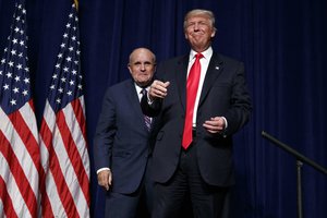 Republican presidential candidate Donald Trump, right, stands with former New York Mayor Rudy Giuliani during a campaign rally, Tuesday, Sept. 6, 2016, in Greenville, N.C.