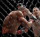 Conor McGregor punches Eddie Alvarez during the UFC 205 event at Madison Square Garden.