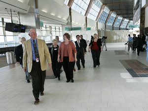 Media and guests tour the final area of Will Rogers World Airport to reach completion, in Oklahoma City, Monday, Nov. 13, 2006. Ceremonies were held to celebrate the completion of a five-year expansion and renovation of the airport.