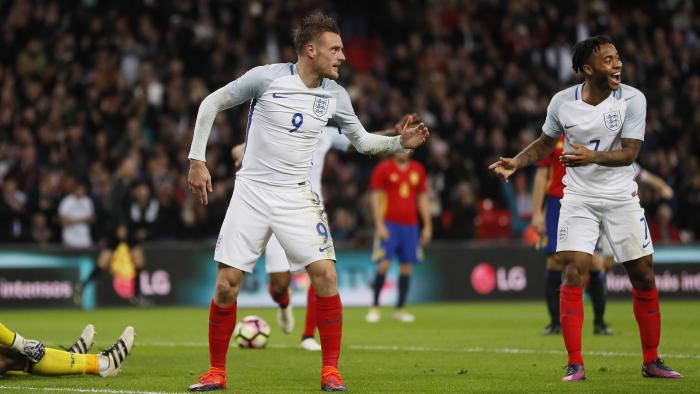 England's Jamie Vardy, center, and Raheem Sterling, right, celebrate after Vardy scored his side's second goal passing Spain's goalkeeper Jose Reina, left, during the international friendly soccer match between England and Spain at the Wembley stadium, London, Tuesday, Nov. 15, 2016. (AP Photo/Kirsty Wigglesworth)