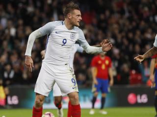 England's Jamie Vardy, center, and Raheem Sterling, right, celebrate after Vardy scored his side's second goal passing Spain's goalkeeper Jose Reina, left, during the international friendly soccer match between England and Spain at the Wembley stadium, London, Tuesday, Nov. 15, 2016. (AP Photo/Kirsty Wigglesworth)