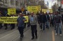 Taxi drivers march through the city.