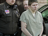 FILE - In this March 3, 2006 file photo, Brendan Dassey, is escorted out of a Manitowoc County Circuit courtroom in Manitowoc, Wis. Dassey, whose homicide conviction was overturned in a case profiled in the Netflix series "Making a Murderer" was ordered released Monday, Nov. 14, 2016, from federal prison while prosecutors appeal. Dassey's supervised release was not immediate and is contingent upon him meeting multiple conditions. (AP Photo/Morry Gash, File)