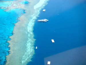 File - Aerial view from a helicopter ride over the Great Barrier Reef at the Whitsunday Islands, Australia.