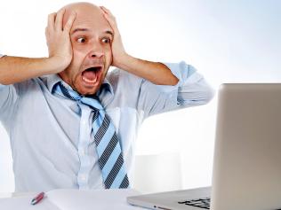 Stressed person using computer. Picture: iStock.