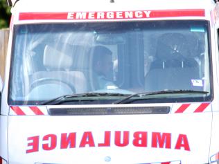 Siege in Garfield. Paramedics treat the man in the back of an ambulance before taking him away. Picture: Hamilton Fiona