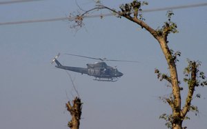 A Pakistan army helicopter flies over the Bacha Khan University, which is under attack by gumen in Charsadda town, some 35 kilometers (21 miles) outside the city of Peshawar, Pakistan, Wednesday, Jan. 20, 2016.