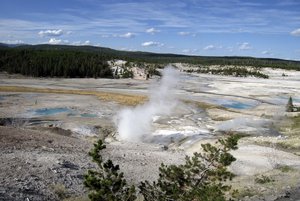 FILE - This September, 2009 file photo shows the Norris Geyser Basin in Yellowstone National Park, Wyo. Rangers are navigating a dangerous landscape where boiling water flows beneath a fragile rock crust as they search for a man who reportedly fell into a hot spring at Yellowstone National Park.