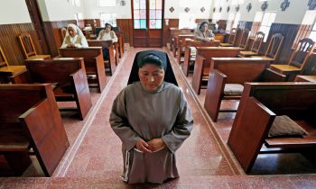 A Poor Clare Sister at prayer (AP)