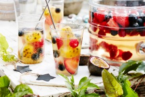 Berry sangria with passionfruit ice cubes