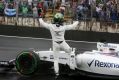 Brazilian Felipe Massa waves to the crowd after crashing during the Brazilian grand prix on Sunday.