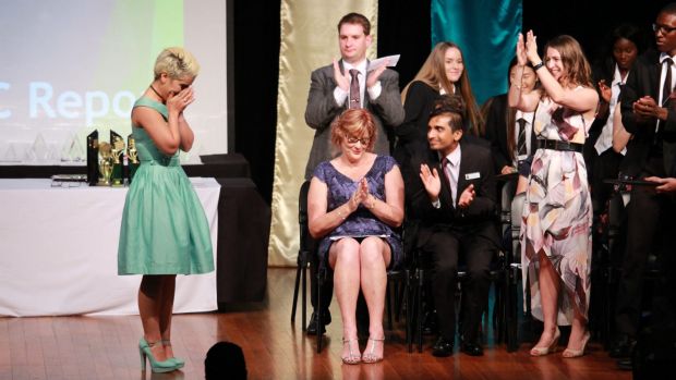 An emotional moment on stage as Mojgan Shamsalipoor graduates at the Yeronga State High School awards night.