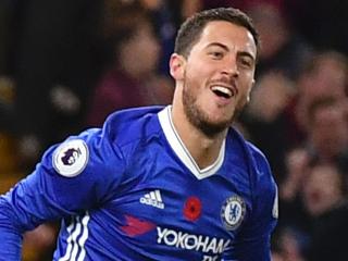 Chelsea's Belgian midfielder Eden Hazard celebrates after scoring their fourth goal during the English Premier League football match between Chelsea and Everton at Stamford Bridge in London on November 5, 2016. / AFP PHOTO / Ben STANSALL / RESTRICTED TO EDITORIAL USE. No use with unauthorized audio, video, data, fixture lists, club/league logos or 'live' services. Online in-match use limited to 75 images, no video emulation. No use in betting, games or single club/league/player publications. /