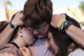 Environmental activists comfort each other during a protest against President-elect Donald Trump at the Climate ...