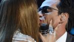 Jennifer Lopez (L) kisses Marc Anthony during the show of the 17th Annual Latin Grammy Awards on November 17, 2016, in Las Vegas, Nevada. / AFP PHOTO / Valerie MACON