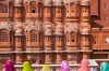 Women in bright saris in front of the Hawa Mahal (Palace of the Winds), built in 1799, Jaipur, Rajasthan, India.