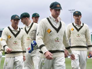 Australian captain Steve Smith leads the team from the field at stumps on day one of the 2nd Test match between Australia and South Africa at Bellerive Oval in Hobart, Saturday, Nov. 12, 2016. (AAP Image/Dave Hunt) NO ARCHIVING, EDITORIAL USE ONLY, IMAGES TO BE USED FOR NEWS REPORTING PURPOSES ONLY, NO COMMERCIAL USE WHATSOEVER, NO USE IN BOOKS WITHOUT PRIOR WRITTEN CONSENT FROM AAP