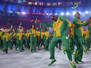 Members of South Africa's delegation dance during the opening ceremony of the Rio 2016 Olympic Games at the Maracana stadium in Rio de Janeiro on August 5, 2016. / AFP PHOTO / Leon NEAL