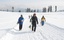 Foreigner skiers carry ski equipment at a ski resort in Gulmarg, some 55kms west of  Srinagar Friday on 17, January 2014.