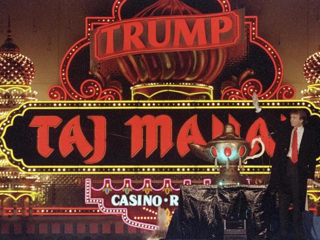 Mr Trump at the opening of the Trump Taj Mahal casino in Atlantic City, New Jersey, in 1990. Picture: Mike Derer/AP