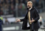 Bayern head coach pep Guardiola, gestures during the German Bundesliga soccer match between Hannover 96 and FC Bayern Munich in Hannover, Germany, Saturday, Dec. 19, 2015. Munich defeated Hannover by 1-0.