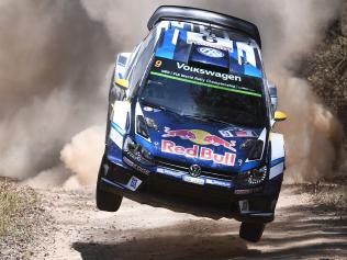 Andreas Mikkelsen of Norway leaps over a jump in his Volkswagen Polo WRC car during the second day of the World Rally Championship (WRC) event, the Rally of Australia, near Bowraville on November 19, 2016. / AFP PHOTO / WILLIAM WEST