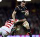 Wales Sam Warburton charges forward during the match against Japan.