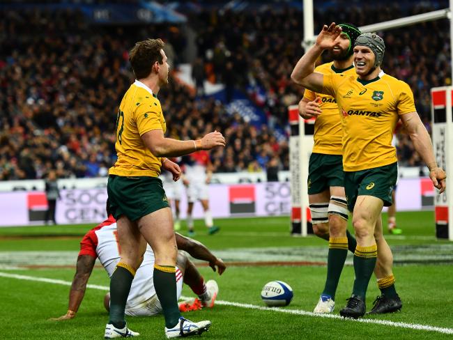 Bernard Foley of Australia celebrates after scoring his side's second try with David Pocock