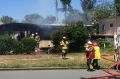 Fire crews on scene at Strathpine after a house fire caused the roof to collapse and threatened surrounding homes.