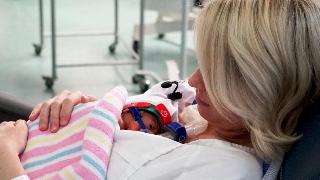 Danielle Paull cuddles her four week old baby Sadie who was born premature at 24 weeks at the Royal Hospital for Women at Randwick. Danielle is still pregnant with Sadie's baby brother four weeks after her birth in a medical miracle.