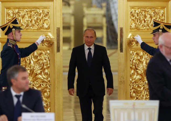 Russian President Vladimir Putin arrives to speak at a Presidential Council for Civil Society and Human Rights meeting in the Grand Kremlin Palace on Oct. 1, 2015, in Moscow, Russia. 